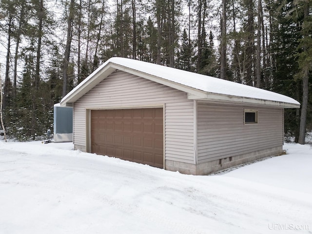 view of snow covered garage