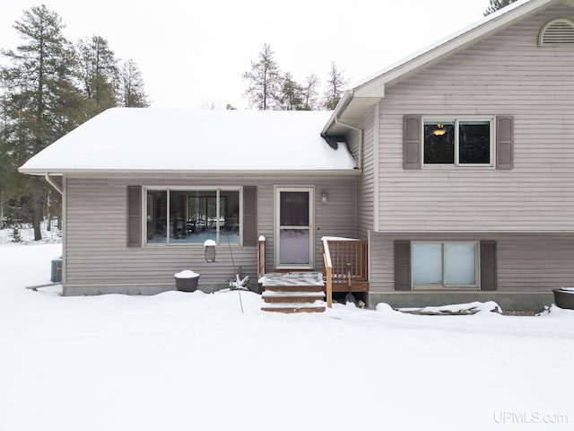 view of front of home featuring cooling unit