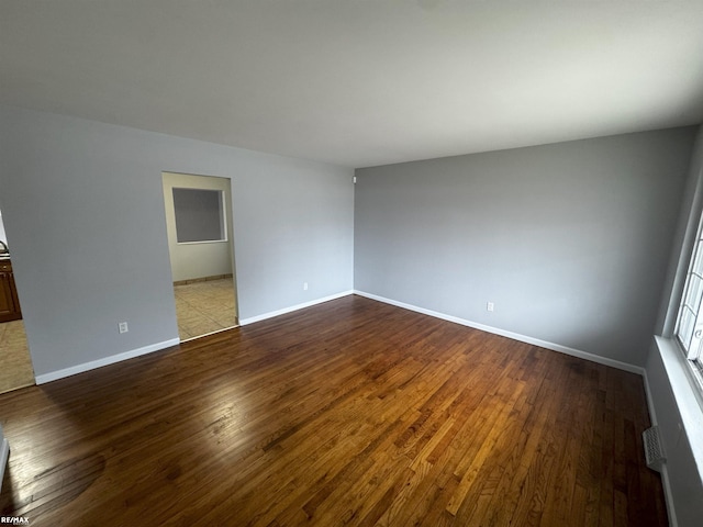 spare room featuring light wood-type flooring