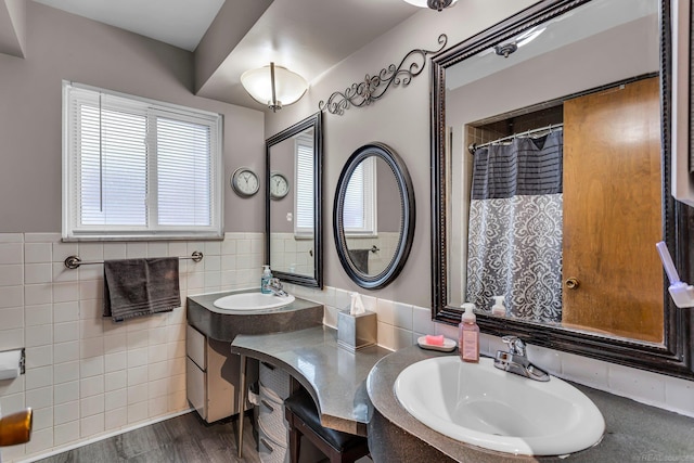 bathroom featuring tile walls, vanity, and hardwood / wood-style floors