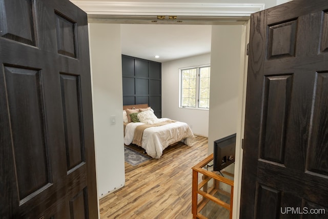 bedroom with light hardwood / wood-style flooring