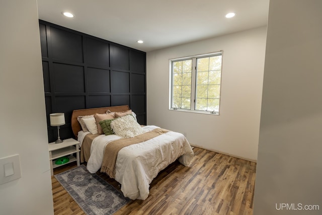 bedroom featuring wood-type flooring