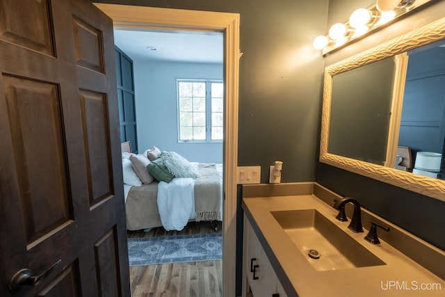 bathroom with vanity and hardwood / wood-style floors