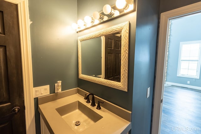 bathroom featuring hardwood / wood-style flooring and vanity