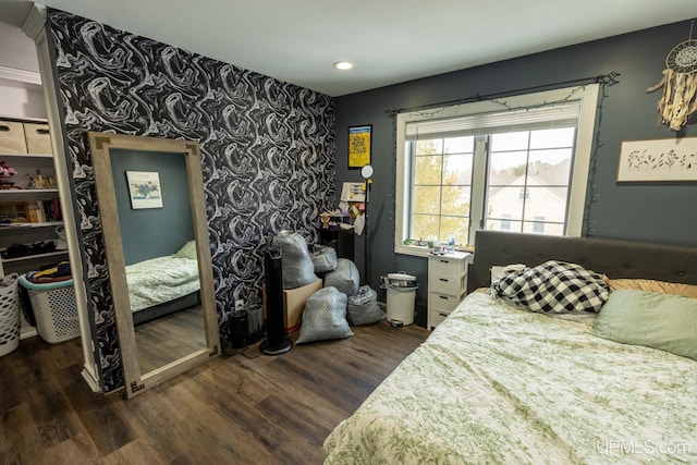 bedroom featuring dark hardwood / wood-style flooring