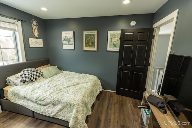 bedroom featuring dark hardwood / wood-style floors