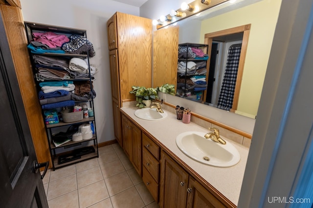 bathroom featuring tile patterned flooring and vanity