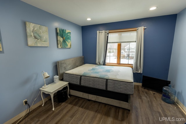 bedroom featuring dark wood-type flooring