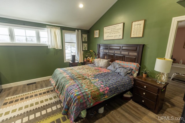 bedroom featuring hardwood / wood-style flooring and vaulted ceiling