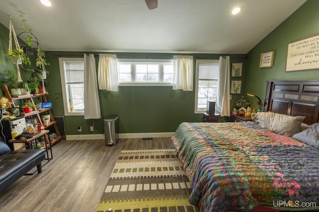 bedroom with hardwood / wood-style floors and vaulted ceiling