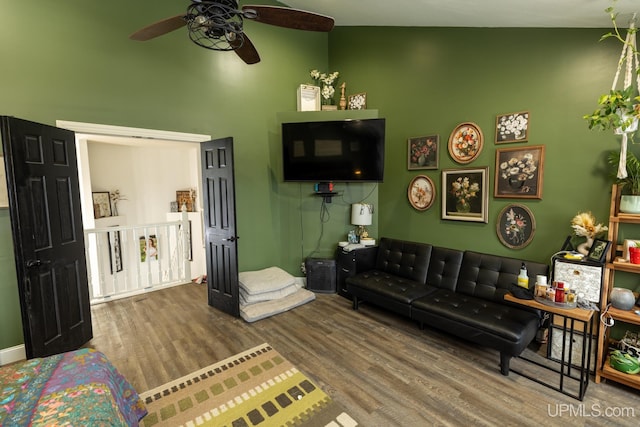 living room with hardwood / wood-style flooring and ceiling fan