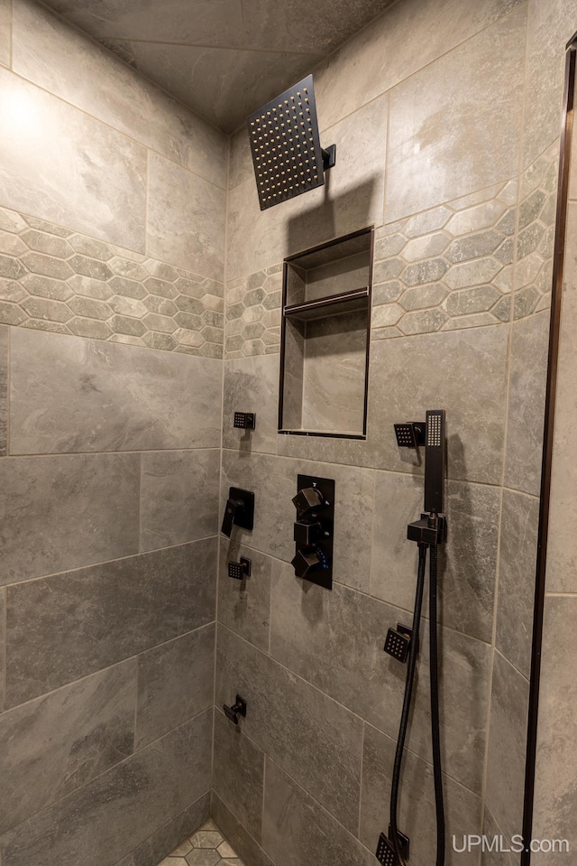 bathroom with a tile shower