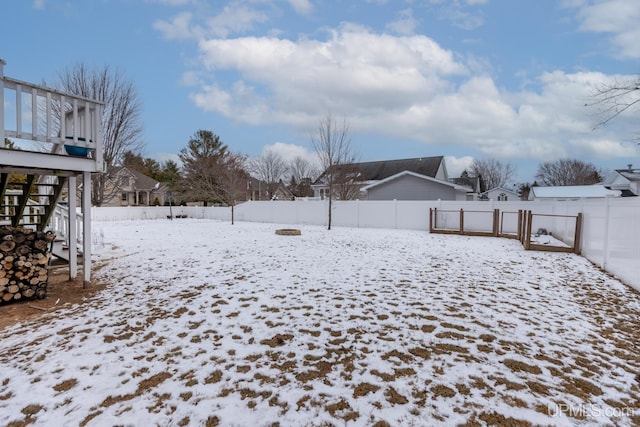 view of yard layered in snow