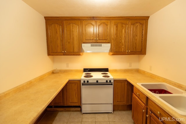 kitchen featuring electric stove, sink, and light tile patterned floors