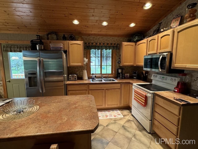 kitchen featuring sink, wood ceiling, light tile patterned floors, stainless steel appliances, and light brown cabinets