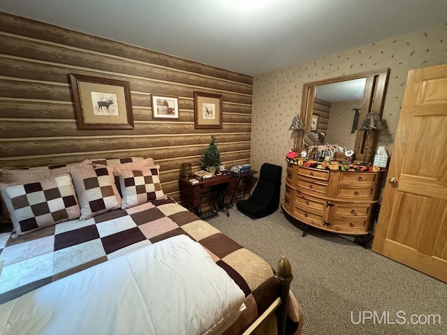 bedroom with carpet floors and rustic walls