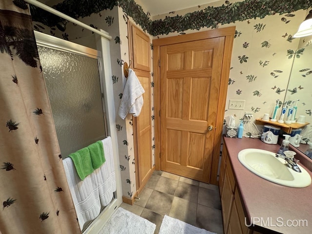 bathroom with vanity, tile patterned flooring, and a shower with shower door