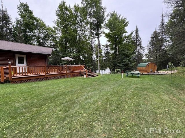 view of yard featuring a wooden deck