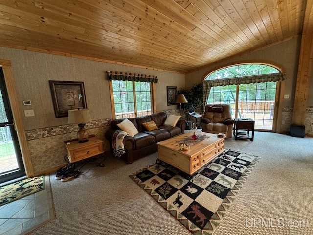 unfurnished living room with vaulted ceiling, carpet floors, and wood ceiling