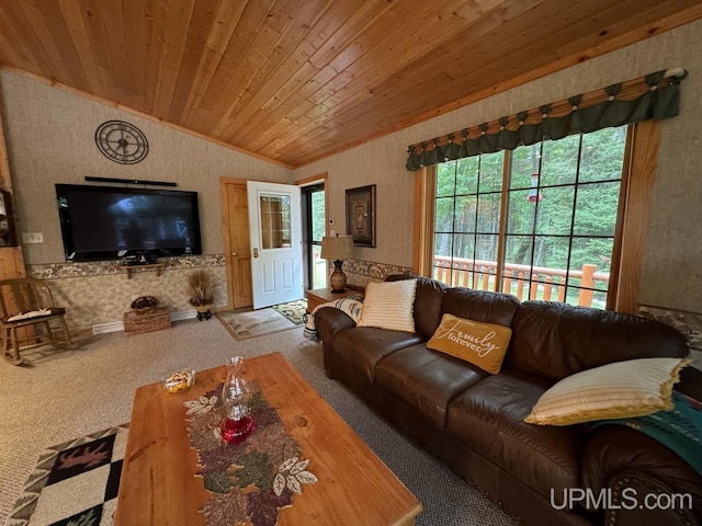 living room featuring lofted ceiling, carpet floors, and wood ceiling