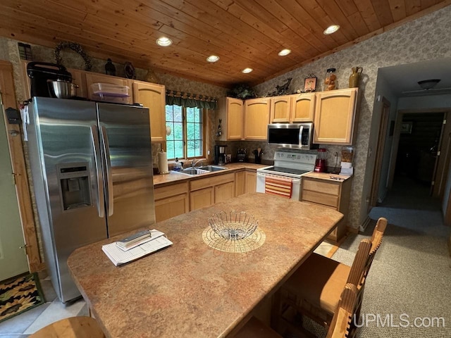 kitchen with wood ceiling, stainless steel appliances, light brown cabinetry, and vaulted ceiling