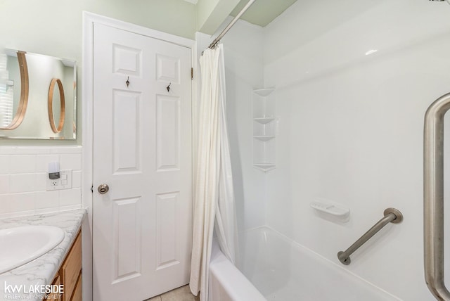 bathroom with shower / bath combination with curtain and vanity