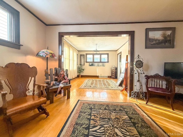 interior space featuring crown molding and hardwood / wood-style floors