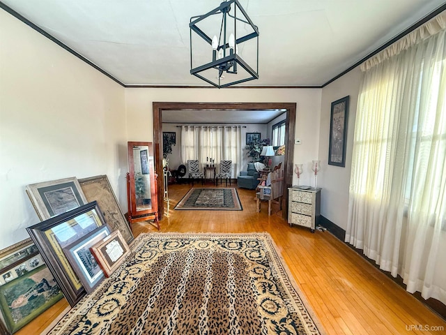 hallway with wood-type flooring and crown molding