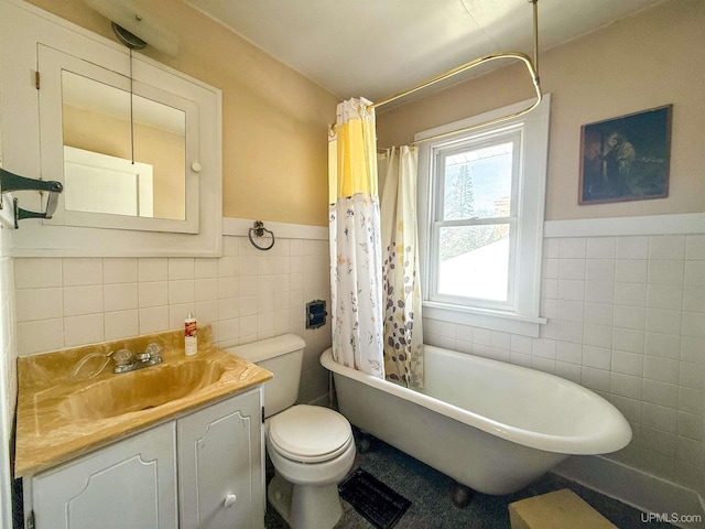 full bathroom featuring tile walls, vanity, toilet, and shower / bath combo with shower curtain