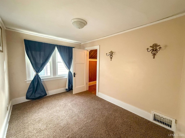 carpeted empty room with ornamental molding