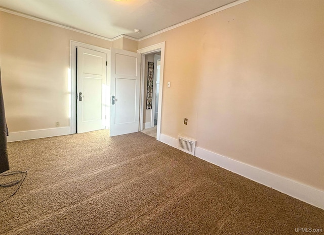 carpeted spare room with crown molding