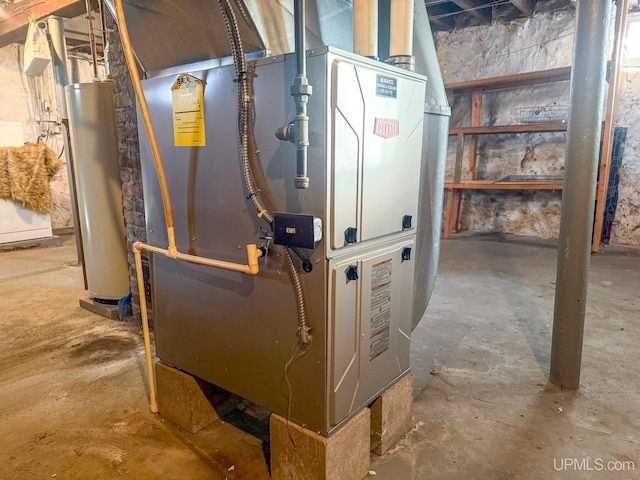 utility room with heating unit and water heater