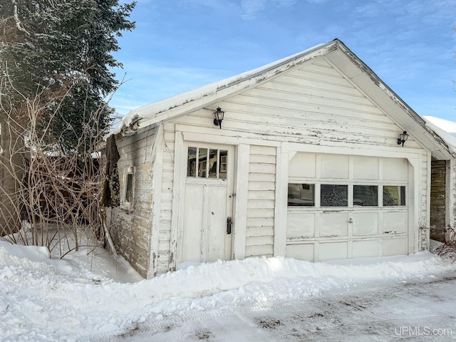 view of snow covered garage