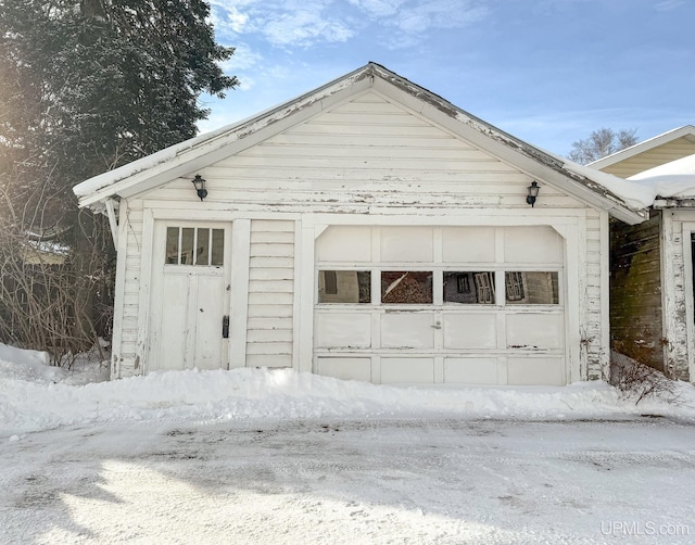 view of snow covered garage