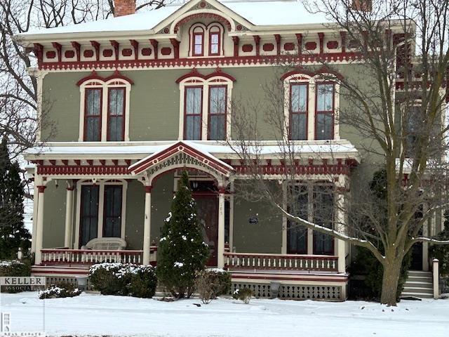 italianate house featuring covered porch