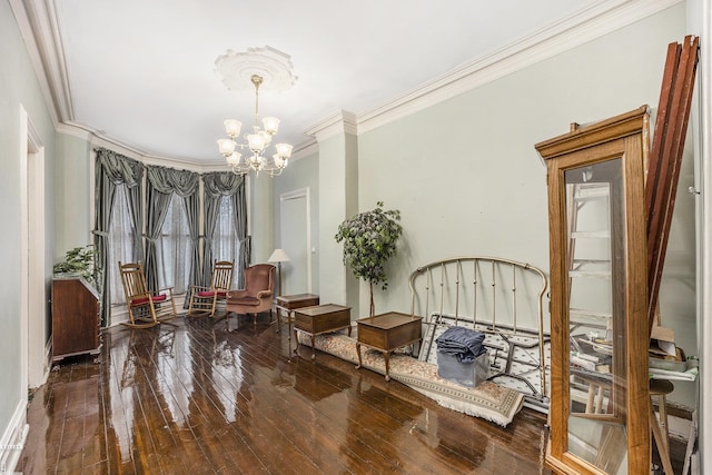 living area with a notable chandelier, wood-type flooring, and ornamental molding