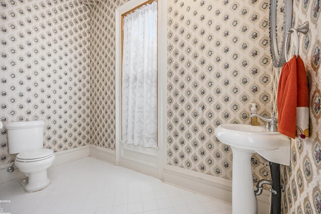 bathroom featuring tile patterned flooring and toilet