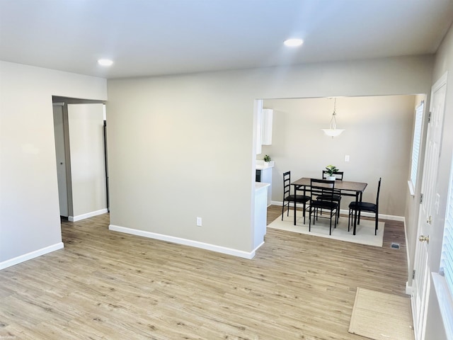 unfurnished room with light wood-type flooring