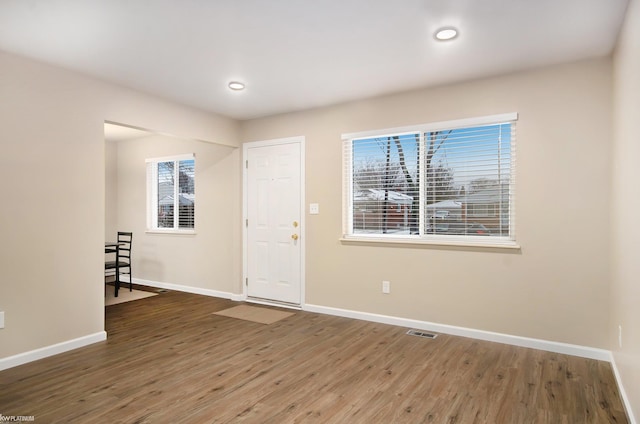 entrance foyer featuring dark hardwood / wood-style flooring