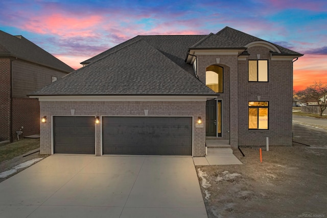 french country home featuring a garage