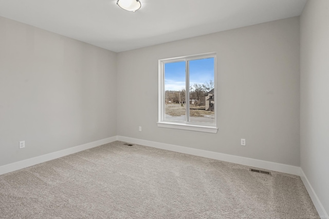 spare room featuring carpet flooring