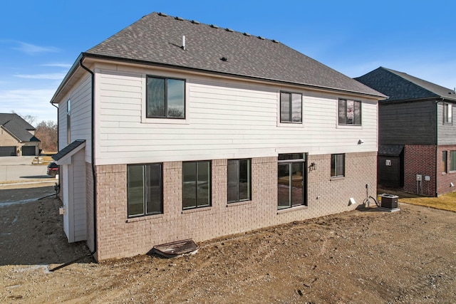 back of house featuring cooling unit