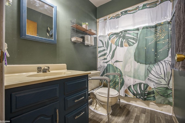 bathroom with vanity, hardwood / wood-style floors, and toilet