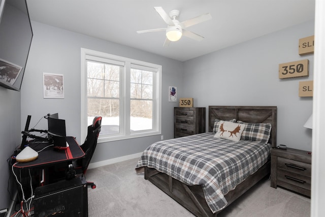 bedroom with ceiling fan and light colored carpet