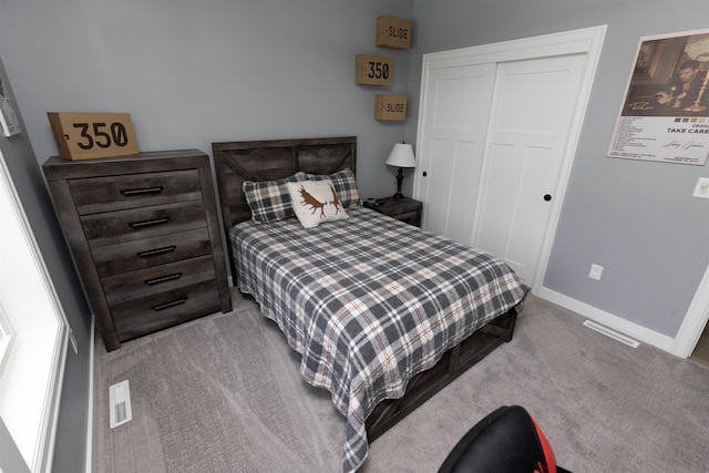 carpeted bedroom featuring a closet