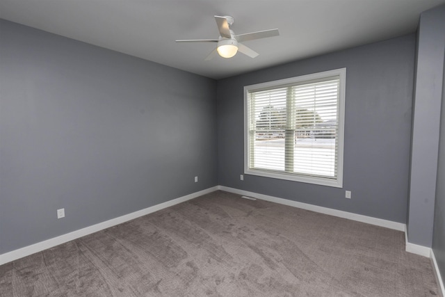 empty room with light carpet and ceiling fan