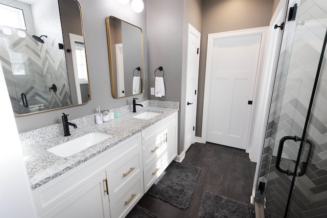 bathroom with vanity and an enclosed shower