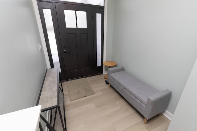 entryway with light hardwood / wood-style floors