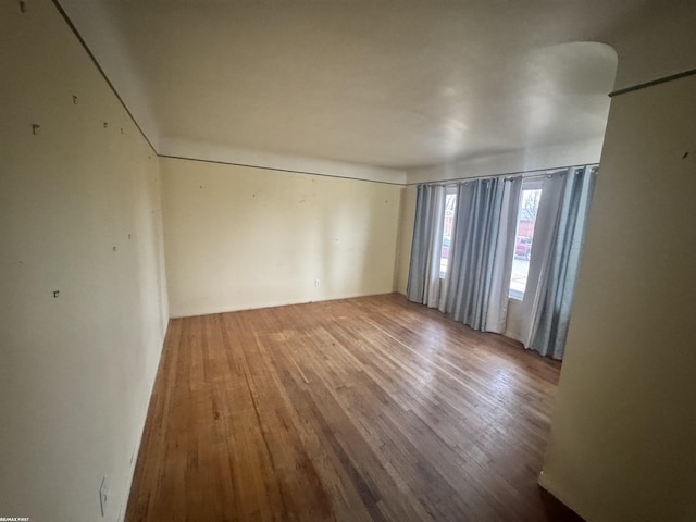 unfurnished room featuring wood-type flooring