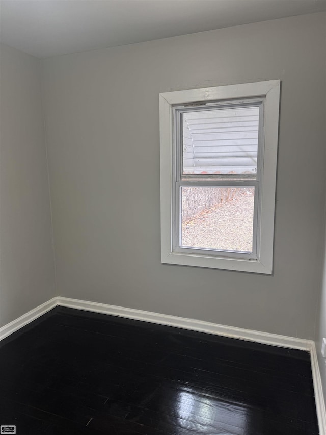 unfurnished room featuring wood-type flooring